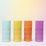 Load image into Gallery viewer,  Four different colors of noz sunscreens lined up next to each other
