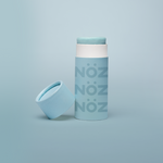 Load image into Gallery viewer,  Noz blue sunscreen open with the cap beside it, on a blue background
